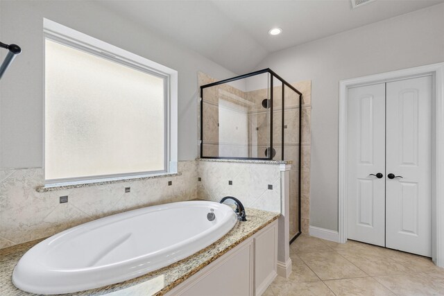 301 Prairie Oak Ct, Burleson, TX 76028 - bathroom with a stall shower, a garden tub, tile patterned flooring, vaulted ceiling, and recessed lighting