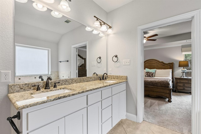 301 Prairie Oak Ct, Burleson, TX 76028 - ensuite bathroom with double vanity, vaulted ceiling, tile patterned floors, and ceiling fan