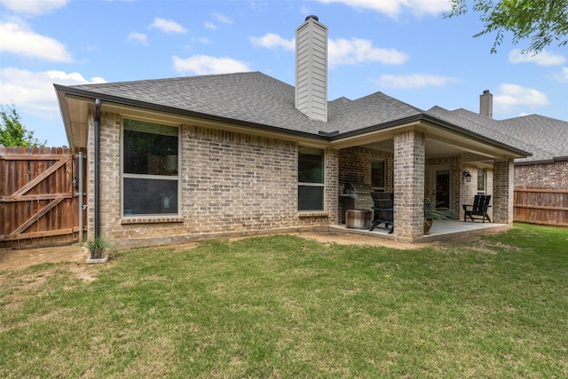 301 Prairie Oak Ct, Burleson, TX 76028 - back of property featuring a patio area, brick siding, a shingled roof, and a chimney