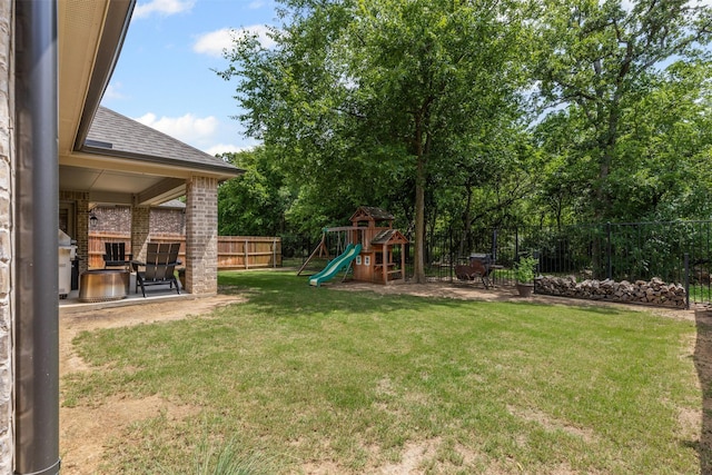 301 Prairie Oak Ct, Burleson, TX 76028 - fenced backyard featuring a playground and a patio area