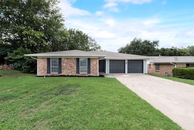 5504 Whitman Ave, Fort Worth, TX 76133 - ranch-style house with an attached garage, concrete driveway, a front lawn, and brick siding
