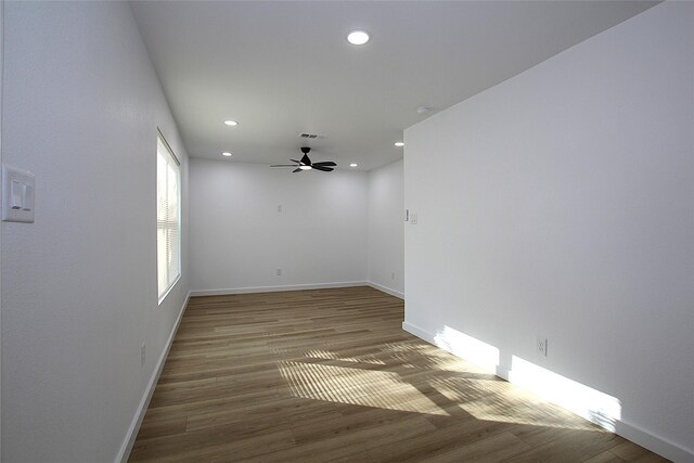 1825 Grove Cir, Mesquite, TX 75149 - empty room with wood finished floors, ceiling fan, and recessed lighting