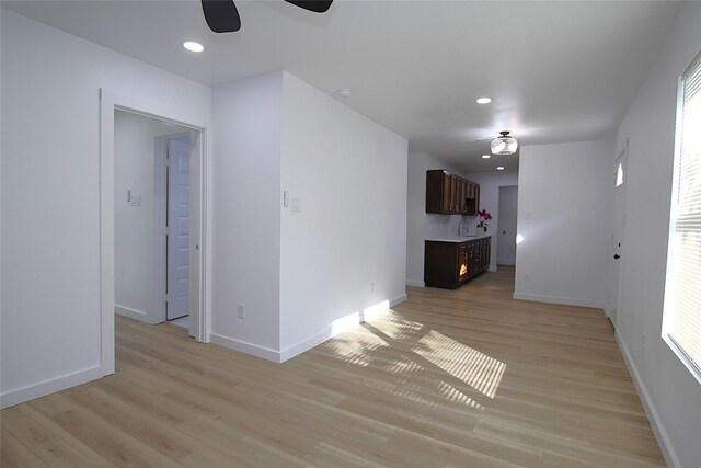 1825 Grove Cir, Mesquite, TX 75149 - unfurnished living room with a ceiling fan, light wood-style floors, and recessed lighting