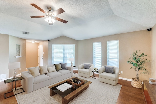 5012 Frontier Ln, Plano, TX 75023 - living area with ceiling fan, wood finished floors, lofted ceiling, and a textured ceiling