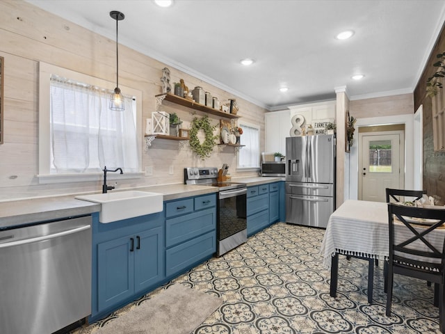 309 E 3rd St, Maypearl, TX 76064 - kitchen with stainless steel appliances, blue cabinetry, ornamental molding, decorative light fixtures, and recessed lighting