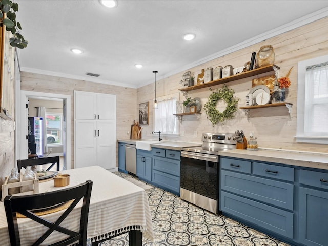 309 E 3rd St, Maypearl, TX 76064 - kitchen with appliances with stainless steel finishes, blue cabinetry, open shelves, crown molding, and light countertops