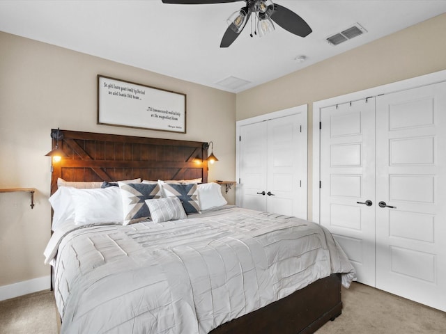 309 E 3rd St, Maypearl, TX 76064 - bedroom with carpet floors, two closets, and a ceiling fan