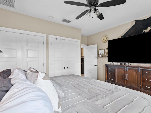 309 E 3rd St, Maypearl, TX 76064 - bedroom with multiple closets and a ceiling fan