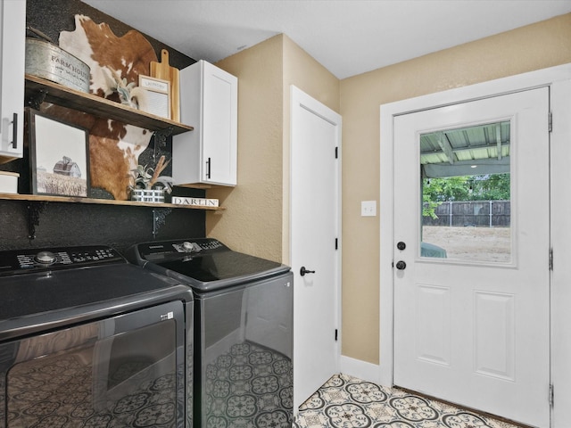 309 E 3rd St, Maypearl, TX 76064 - laundry area with cabinet space and separate washer and dryer