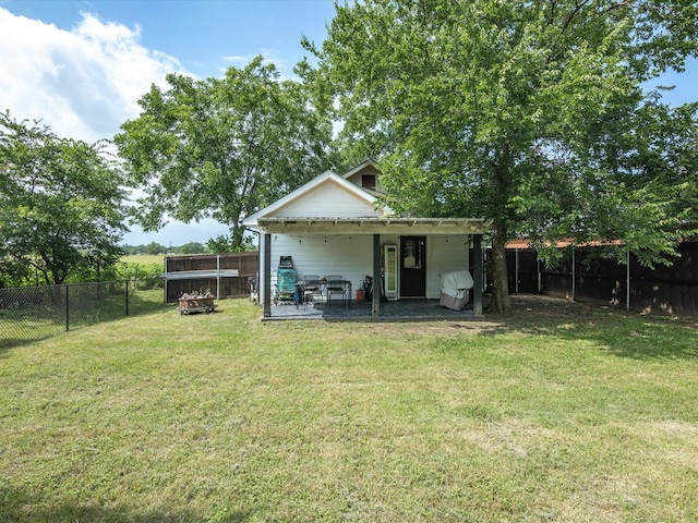 309 E 3rd St, Maypearl, TX 76064 - back of house with a fenced backyard and a patio area