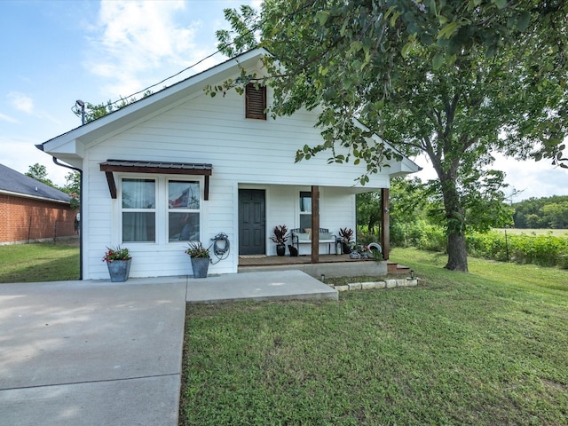 309 E 3rd St, Maypearl, TX 76064 - view of front of home with a porch and a front yard