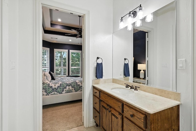 6617 Whittier Ln, Colleyville, TX 76034 - ensuite bathroom featuring vanity, a ceiling fan, and a tray ceiling