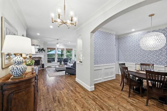 6617 Whittier Ln, Colleyville, TX 76034 - dining space featuring ornamental molding, a chandelier, arched walkways, wood finished floors, and ceiling fan