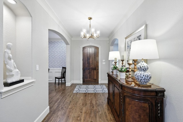 6617 Whittier Ln, Colleyville, TX 76034 - entrance foyer with arched walkways, crown molding, a chandelier, and dark wood finished floors