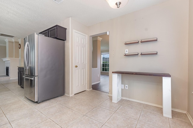 2120 Valley Falls Ave, Mesquite, TX 75181 - kitchen featuring freestanding refrigerator and light tile patterned floors