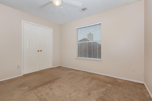 2120 Valley Falls Ave, Mesquite, TX 75181 - unfurnished bedroom with carpet, a closet, and ceiling fan