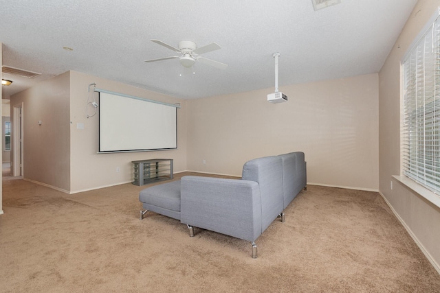 2120 Valley Falls Ave, Mesquite, TX 75181 - carpeted cinema room with a ceiling fan, a textured ceiling, and healthy amount of natural light
