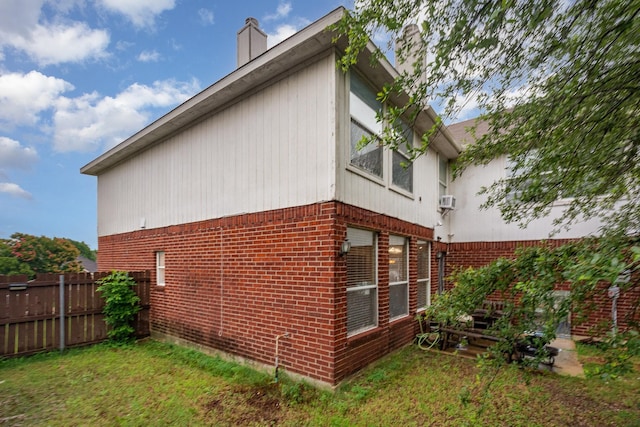 2120 Valley Falls Ave, Mesquite, TX 75181 - view of side of home with a chimney and brick siding