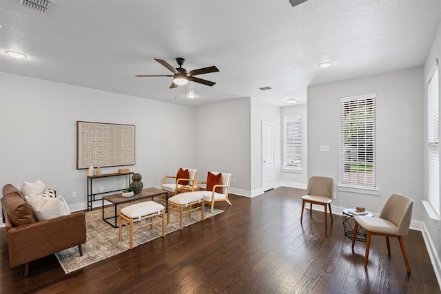 2905 Merrimac St, Fort Worth, TX 76107 - living area with dark wood-style flooring, a ceiling fan, and a textured ceiling