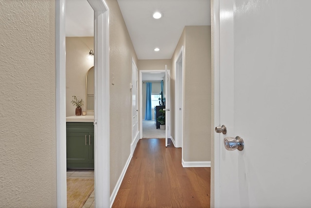3767 Matson St, North Richland Hills, TX 76117 - corridor with wood finished floors, recessed lighting, and a textured wall