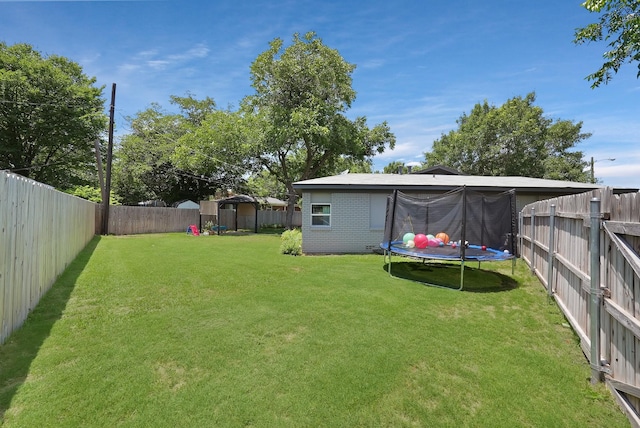 3767 Matson St, North Richland Hills, TX 76117 - fenced backyard with a trampoline