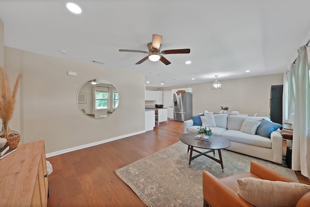 3767 Matson St, North Richland Hills, TX 76117 - living room featuring wood finished floors, ceiling fan, and recessed lighting