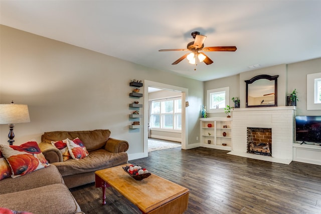 2324 Lynnhaven Rd, Fort Worth, TX 76103 - living area featuring a ceiling fan, a fireplace, and dark wood finished floors