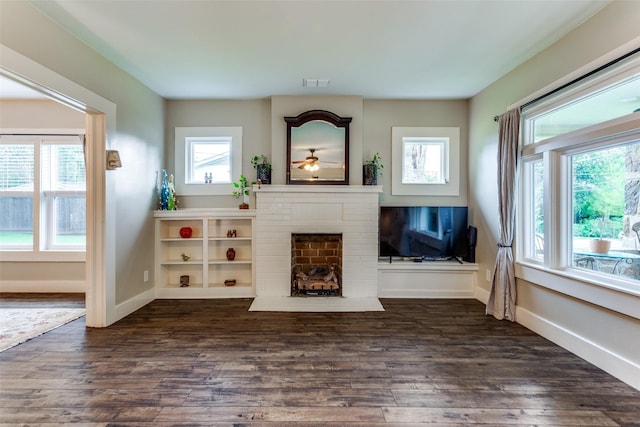 2324 Lynnhaven Rd, Fort Worth, TX 76103 - living room featuring a brick fireplace, a ceiling fan, and dark wood-type flooring