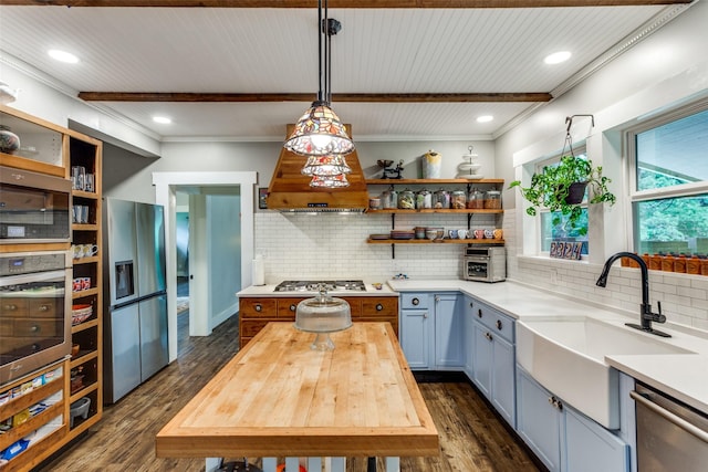 2324 Lynnhaven Rd, Fort Worth, TX 76103 - kitchen featuring appliances with stainless steel finishes, open shelves, dark wood finished floors, wooden counters, and tasteful backsplash