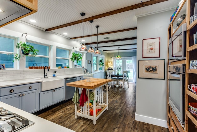 2324 Lynnhaven Rd, Fort Worth, TX 76103 - kitchen featuring stainless steel appliances, gray cabinets, backsplash, dark wood-style flooring, and recessed lighting