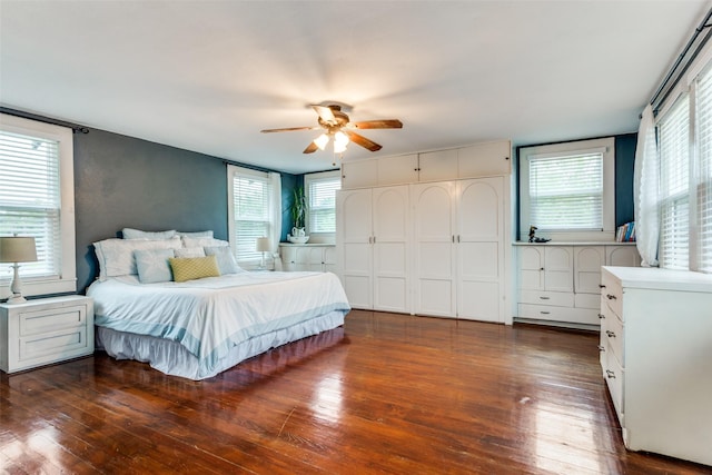 2324 Lynnhaven Rd, Fort Worth, TX 76103 - bedroom featuring wood finished floors, multiple windows, and a ceiling fan