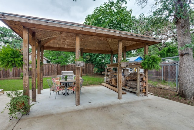 2324 Lynnhaven Rd, Fort Worth, TX 76103 - fenced backyard with a gazebo, a patio, and outdoor dining space
