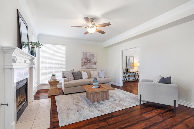 1092 Rosewood Dr, Grapevine, TX 76051 - living room with ornamental molding, a ceiling fan, a fireplace with flush hearth, and light wood-type flooring
