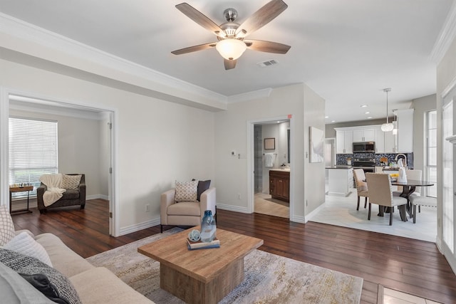 1092 Rosewood Dr, Grapevine, TX 76051 - living area featuring dark wood finished floors, a ceiling fan, crown molding, and recessed lighting