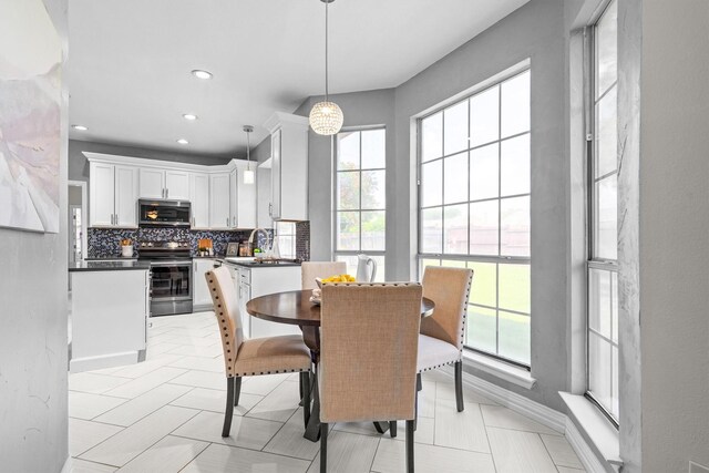 1092 Rosewood Dr, Grapevine, TX 76051 - dining room featuring healthy amount of natural light and recessed lighting