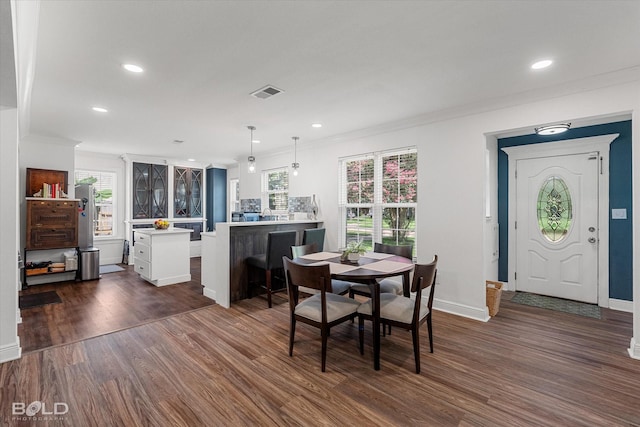 107 Preston Ave, Shreveport, LA 71105 - dining space featuring dark wood finished floors, ornamental molding, and recessed lighting