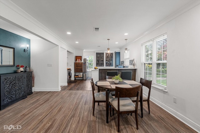 107 Preston Ave, Shreveport, LA 71105 - dining room featuring dark wood finished floors, recessed lighting, and crown molding