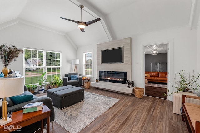 107 Preston Ave, Shreveport, LA 71105 - living area featuring dark wood-type flooring, lofted ceiling, a fireplace, and a ceiling fan