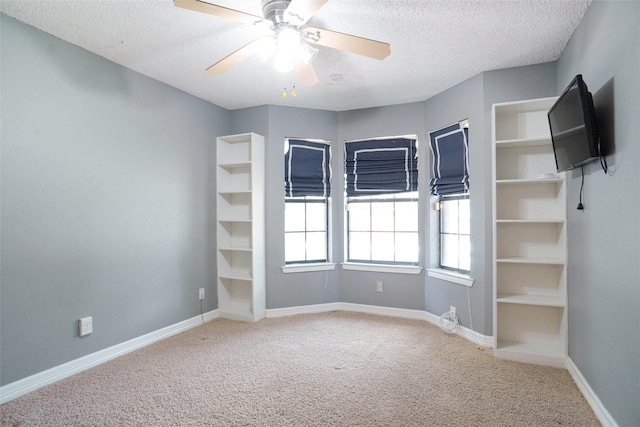 7440 Meadowview Ter, North Richland Hills, TX 76182 - carpeted spare room featuring a textured ceiling and ceiling fan