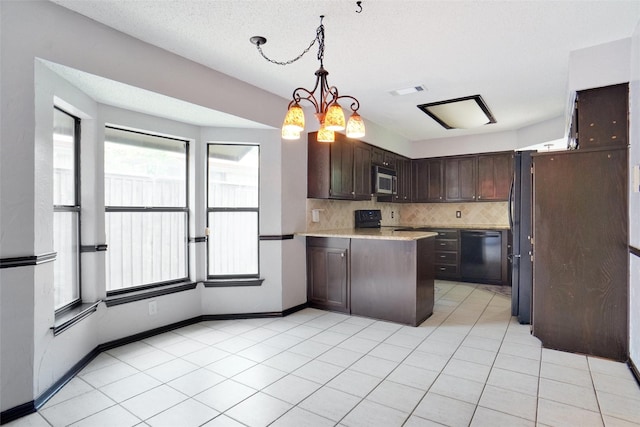 7440 Meadowview Ter, North Richland Hills, TX 76182 - kitchen featuring dishwasher, stainless steel microwave, dark brown cabinetry, light countertops, and tasteful backsplash