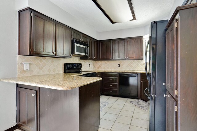 7440 Meadowview Ter, North Richland Hills, TX 76182 - kitchen with black appliances, a peninsula, dark brown cabinetry, tasteful backsplash, and light tile patterned floors
