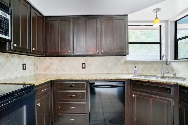 7440 Meadowview Ter, North Richland Hills, TX 76182 - kitchen with black appliances, dark brown cabinetry, light stone countertops, and decorative backsplash