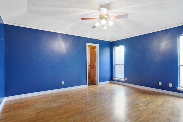 7440 Meadowview Ter, North Richland Hills, TX 76182 - empty room with ceiling fan, wood finished floors, and a textured ceiling