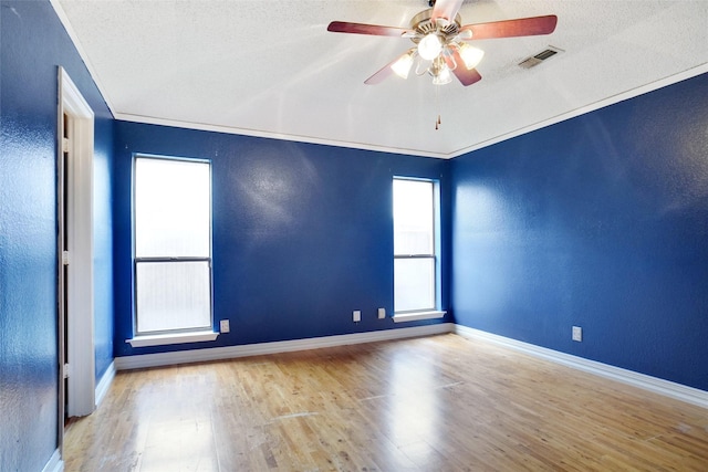 7440 Meadowview Ter, North Richland Hills, TX 76182 - unfurnished room featuring wood finished floors, ceiling fan, a textured ceiling, and a textured wall