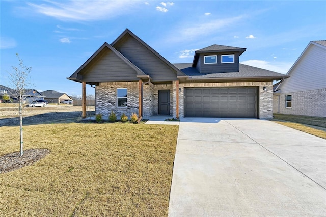 1807 Boxwood Dr, Sherman, TX 75092 - view of front of house with a front lawn, driveway, and brick siding
