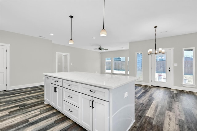 1807 Boxwood Dr, Sherman, TX 75092 - kitchen featuring dark wood-style flooring, white cabinets, hanging light fixtures, and recessed lighting