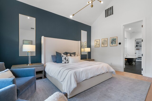 403 Trigger Trl, Argyle, TX 76226 - bedroom featuring wood finished floors and high vaulted ceiling
