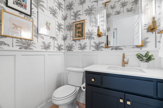 403 Trigger Trl, Argyle, TX 76226 - bathroom featuring wallpapered walls, vanity, a decorative wall, and a wainscoted wall