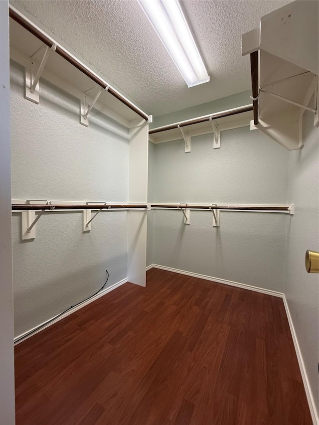 1401 Williams Crk, Mesquite, TX 75181 - walk in closet featuring dark wood-style floors
