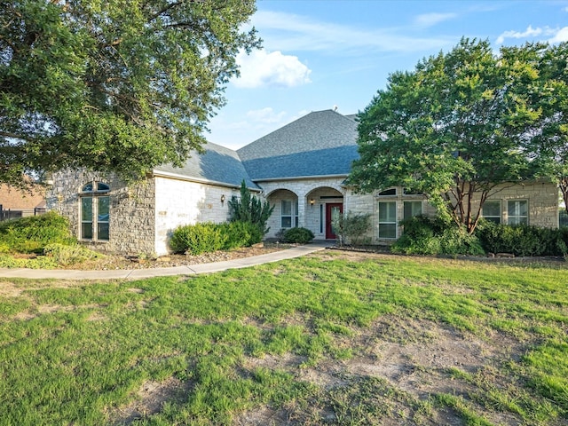 186 Deer Creek Dr, Aledo, TX 76008 - view of front of home with stone siding, a front lawn, and roof with shingles